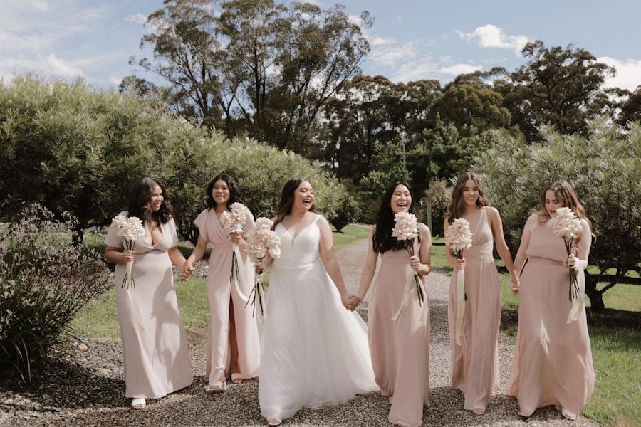 Bridesmaids holding blush bouquets